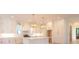 Well-lit kitchen features white cabinetry, marble countertops, stainless steel appliances, and stylish gold hardware at 295 W Coleman Blvd, Mount Pleasant, SC 29464