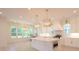 Bright kitchen with a large island, stainless steel appliances, marble countertops and white cabinetry at 295 W Coleman Blvd, Mount Pleasant, SC 29464