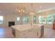 Open-concept kitchen island featuring white marble countertops, ample storage, and stylish pendant lighting at 295 W Coleman Blvd, Mount Pleasant, SC 29464