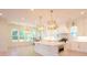 Bright kitchen with a large island, stainless steel appliances, marble countertops and white cabinetry at 295 W Coleman Blvd, Mount Pleasant, SC 29464