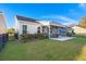 Spacious backyard featuring a screened porch, patio and lush green lawn at 3005 Aura Ln, Summerville, SC 29483