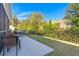 A lovely backyard has a patio, lawn, and classic outdoor dining at 3005 Aura Ln, Summerville, SC 29483
