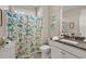 Charming bathroom with seashell shower curtain and granite vanity at 3005 Aura Ln, Summerville, SC 29483