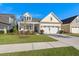 Beautiful two-story home with a well-maintained lawn and a traditional architectural style at 3005 Aura Ln, Summerville, SC 29483