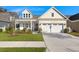 Charming home with a well-manicured lawn, white garage door, and inviting front porch at 3005 Aura Ln, Summerville, SC 29483