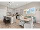 Well-lit kitchen with granite counters, stainless steel appliances, adjacent to dining area, perfect for Gathering meals at 3005 Aura Ln, Summerville, SC 29483