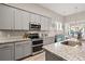 Bright kitchen showcases granite counters, stainless appliances, and a double oven for cooking convenience at 3005 Aura Ln, Summerville, SC 29483