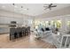 Open concept living and kitchen area with hardwood floors and plenty of natural light at 3005 Aura Ln, Summerville, SC 29483