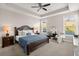 Spacious main bedroom with elegant furnishings, soft lighting, and a comfortable seating area for unwinding at 3005 Aura Ln, Summerville, SC 29483