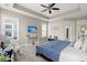 Comfortable main bedroom featuring a tray ceiling, soft carpet, and a wall-mounted TV for relaxation at 3005 Aura Ln, Summerville, SC 29483