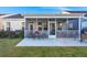A relaxing screened porch with neutral furniture provides an outdoor living space at 3005 Aura Ln, Summerville, SC 29483