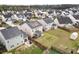 A home's backyard, fence and neighborhood are highlighted in an aerial view of this community at 320 Silverleaf Ln, Moncks Corner, SC 29461