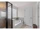 Bathroom featuring a tub and a glass-enclosed shower, offering a relaxing retreat at 320 Silverleaf Ln, Moncks Corner, SC 29461