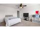 Bright bedroom featuring neutral walls, carpet, ceiling fan, with a television, shelf, and bedding for relaxation and rest at 320 Silverleaf Ln, Moncks Corner, SC 29461