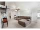 Spacious bonus room with plush carpeting, ceiling fan, ample lighting, and comfortable sectional for relaxation and entertainment at 320 Silverleaf Ln, Moncks Corner, SC 29461