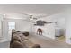 Well-lit bonus room with neutral carpet, ceiling fan, television, sectional and open space provides versatile living area at 320 Silverleaf Ln, Moncks Corner, SC 29461