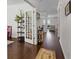 Elegant foyer featuring gleaming hardwood floors and an open view to the living room at 320 Silverleaf Ln, Moncks Corner, SC 29461