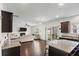 An open-concept home with a kitchen that blends into a living room with lots of natural light at 320 Silverleaf Ln, Moncks Corner, SC 29461