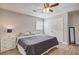 Bright bedroom with a ceiling fan, natural light, and a closet providing ample storage, creating a comfortable retreat at 322 Lantana Dr, Charleston, SC 29407