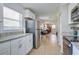 Bright kitchen featuring stainless steel appliances, white cabinets, and granite countertops at 322 Lantana Dr, Charleston, SC 29407