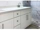 Bathroom featuring a white vanity with drawers and cabinets, along with a modern shower featuring mosaic-patterned tile at 3292 N Highway 52, Saint Stephen, SC 29479