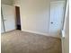 Empty bedroom with carpet flooring, neutral paint, and bright natural light at 3292 N Highway 52, Saint Stephen, SC 29479