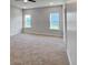 Spacious bedroom with plush carpeting and natural light from the double window at 3292 N Highway 52, Saint Stephen, SC 29479