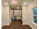 Open concept dining area showcasing a modern light fixture and hardwood flooring at 3292 N Highway 52, Saint Stephen, SC 29479