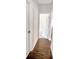 Hallway with a hardwood floor and an open doorway leading to another room at 3292 N Highway 52, Saint Stephen, SC 29479