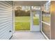 Screened in porch overlooking a green lawn and treeline at 3292 N Highway 52, Saint Stephen, SC 29479