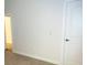 Bright room highlighting neutral walls, white door, and doorway leading to an adjacent space with wood floor at 3292 N Highway 52, Saint Stephen, SC 29479