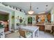 Bright dining area with views of the kitchen, a table and chairs, and decorative touches throughout at 3378 Von Ohsen Rd, Ladson, SC 29485