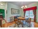 Formal dining room featuring chandelier lighting and a classic wooden table at 3378 Von Ohsen Rd, Ladson, SC 29485