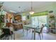 Open-concept kitchen featuring wooden cabinets, an eat-in area, and natural light from a sliding glass door at 3378 Von Ohsen Rd, Ladson, SC 29485
