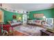 Bright living room with colorful decor, hardwood floors, and comfortable seating at 3378 Von Ohsen Rd, Ladson, SC 29485