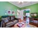 Cozy living room with hardwood floors, comfortable seating, and view into the bedroom at 3378 Von Ohsen Rd, Ladson, SC 29485