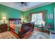 Bright bedroom with hardwood floors, comfortable bedding, and ample natural light at 3378 Von Ohsen Rd, Ladson, SC 29485