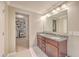 Well-lit Primary bathroom featuring double sinks with granite countertops and a walk-in closet at 353 Dunlin Dr, Summerville, SC 29486