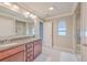 Nicely appointed bathroom featuring double sinks, granite counters and a glass enclosed shower at 353 Dunlin Dr, Summerville, SC 29486