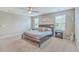 Comfortable bedroom featuring a ceiling fan, bed, two windows, and carpet flooring at 353 Dunlin Dr, Summerville, SC 29486