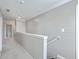 Bright upstairs hallway featuring painted wood accent wall and neutral colors at 353 Dunlin Dr, Summerville, SC 29486