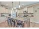 Bright kitchen features a large island with bar seating, granite countertops, and stainless steel appliances at 353 Dunlin Dr, Summerville, SC 29486