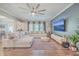Spacious living room featuring a large sectional sofa, modern decor, and a mounted flat screen television at 353 Dunlin Dr, Summerville, SC 29486