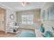 Bright and airy office space boasts a large window, stylish furniture, and elegant decor accents at 353 Dunlin Dr, Summerville, SC 29486