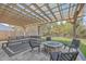 Cozy outdoor patio with fire pit and a covered pergola, ideal for relaxation and entertaining guests at 353 Dunlin Dr, Summerville, SC 29486
