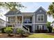 Charming two-story home featuring a covered front porch and beautifully landscaped front yard at 3558 Stockton Dr, Mount Pleasant, SC 29466