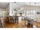 Open kitchen with white cabinets, granite countertops, and hardwood floors at 3558 Stockton Dr, Mount Pleasant, SC 29466