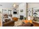Cozy living room featuring a fireplace, built-in shelves, and hardwood floors at 3558 Stockton Dr, Mount Pleasant, SC 29466