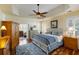 Comfortable bedroom with tray ceilings, hardwood floors, and ample natural light at 3558 Stockton Dr, Mount Pleasant, SC 29466