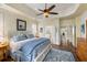 Spacious bedroom with tray ceilings, blue patterned accents, and ensuite bathroom access at 3558 Stockton Dr, Mount Pleasant, SC 29466